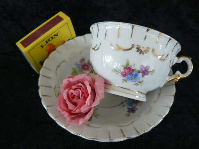 PORCELAIN CUP AND SOUCER