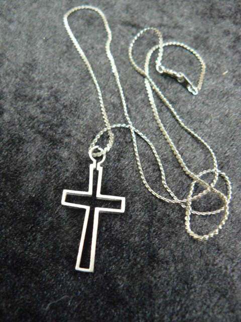 CROSS ON SILVER TONED CHAIN