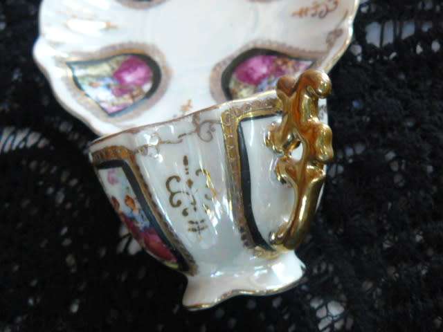 VINTAGE CUP AND SAUCER