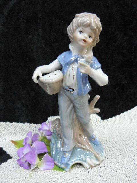 CERAMIC BOY FIGURINE ORNAMENT