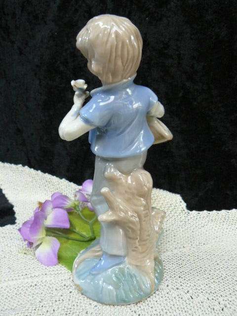 CERAMIC BOY FIGURINE ORNAMENT