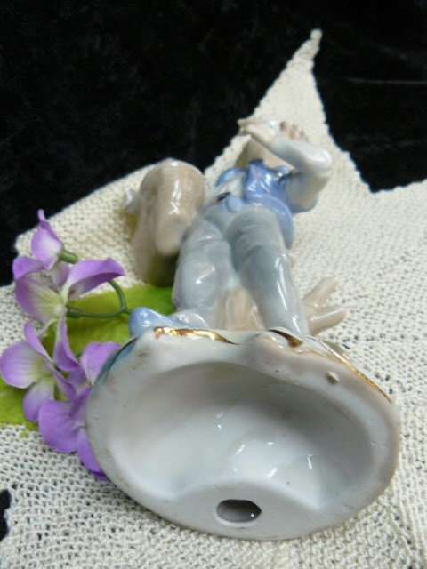 CERAMIC BOY FIGURINE ORNAMENT