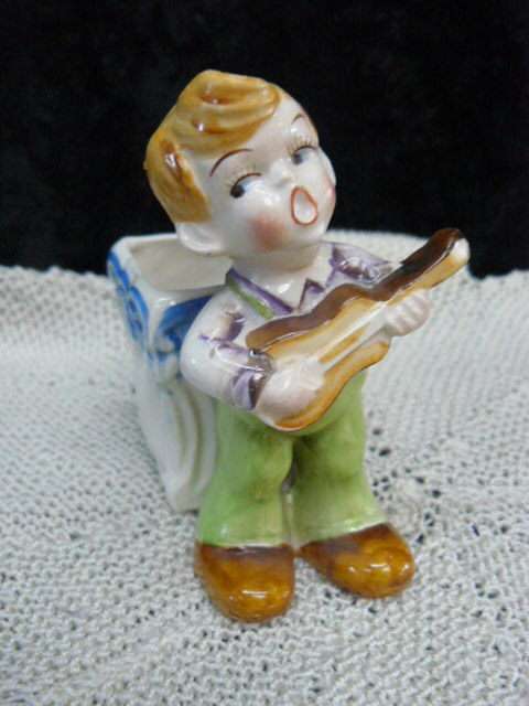 CERAMIC BOY FIGURINE WITH BASKET