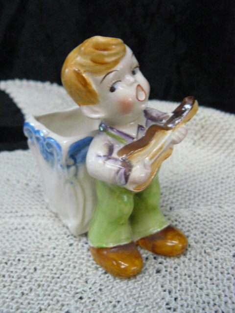 CERAMIC BOY FIGURINE WITH BASKET