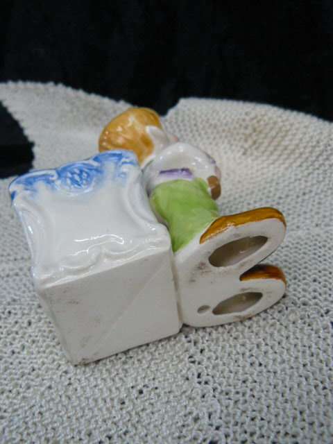 CERAMIC BOY FIGURINE WITH BASKET