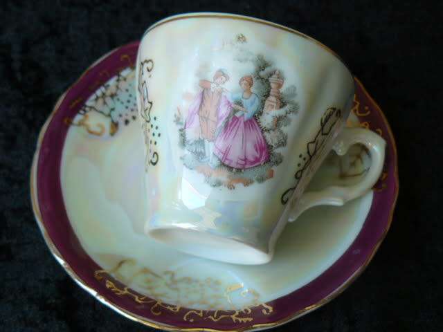 LIMOGES LIKE COFFEE CUP AND SOUCER WITH MOTHE OF PEARL EFFECT