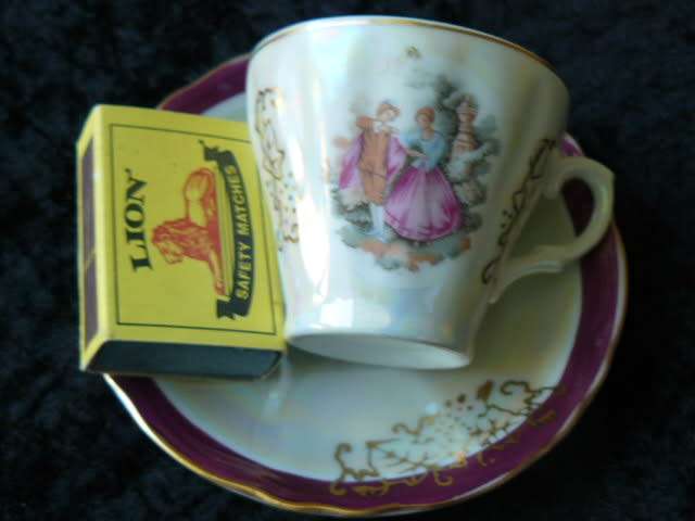 LIMOGES LIKE COFFEE CUP AND SOUCER WITH MOTHE OF PEARL EFFECT