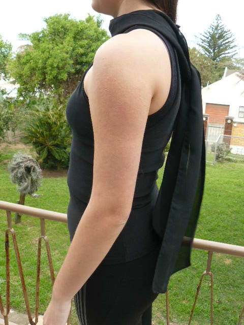 BLACK SLEVELESS TOP WITH ATTATCHED NECK SCARVE MEDIUM