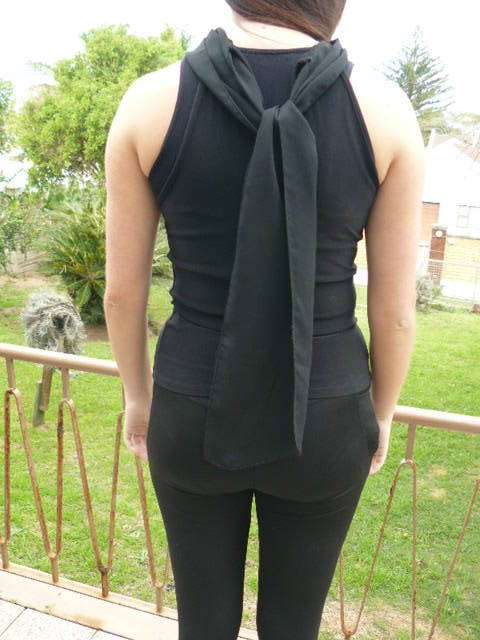 BLACK SLEVELESS TOP WITH ATTATCHED NECK SCARVE MEDIUM
