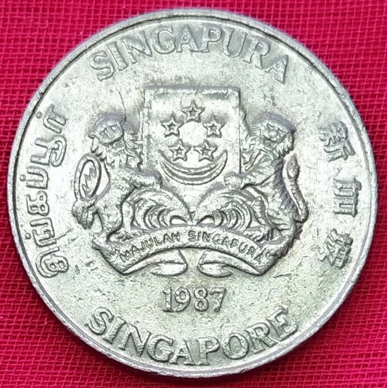 1987   20 Cents ribbon upwards      Singapore         SUN12335*