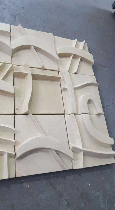 Unique plastered finish/cement type material. Wall hanging--great appeal,funky,modern!!