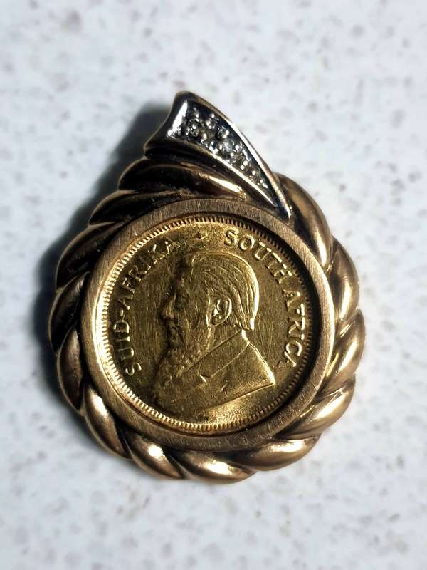 #64- 22CT KRUGER RAND  1991 SET IN 9CT GOLD PENDANT WITH 2 SMALL NATURAL CUT DIAMONDS - 6.92 GRAMS