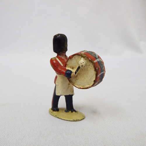 Vintage British lead drummer soldier marching with drum