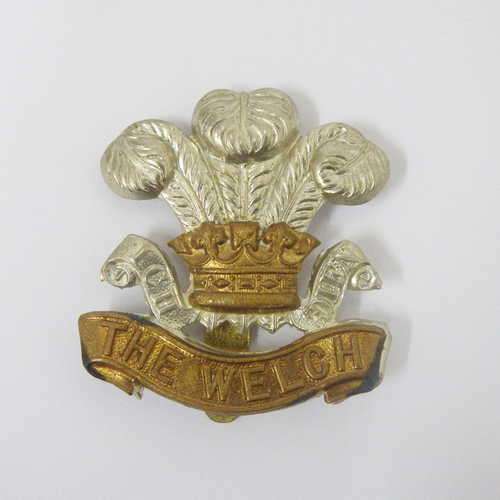 The Welsh regiment bi-metal cap badge with slide