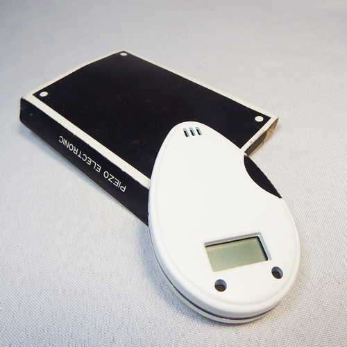 Oval Piezo electronic pocket gas lighter with digital clock (not working or needs battery)
