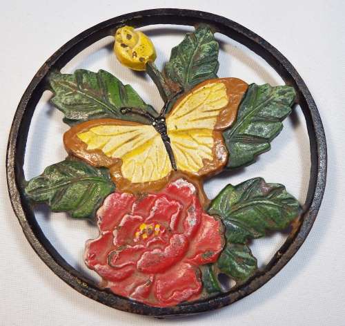 Cast iron pot stand with butterfly