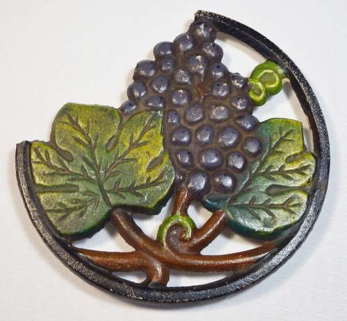 Vintage cast iron Trivet (Pot stand) with Grape Pattern