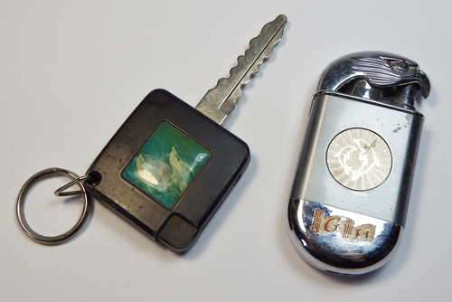 Pair of vintage lighters with dolphins