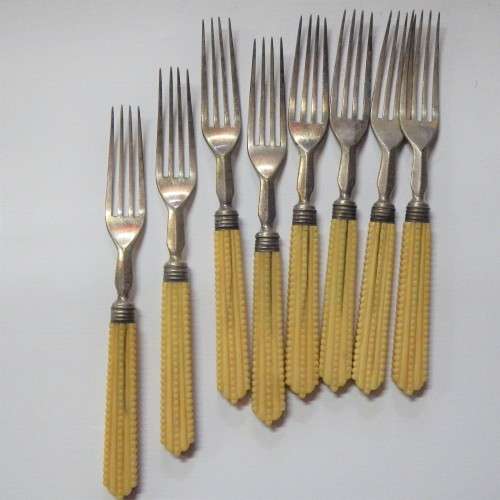 Set of 8 vintage fruit forks with faux ivory handles
