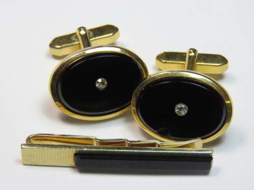 Vintage set of gold plated cufflinks and tie clip with black inserts - One chipped