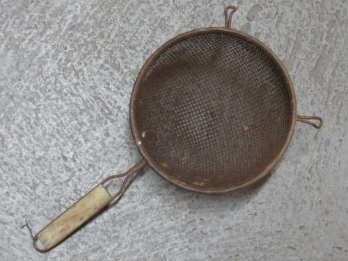 Vintage flour sieve with wooden handle