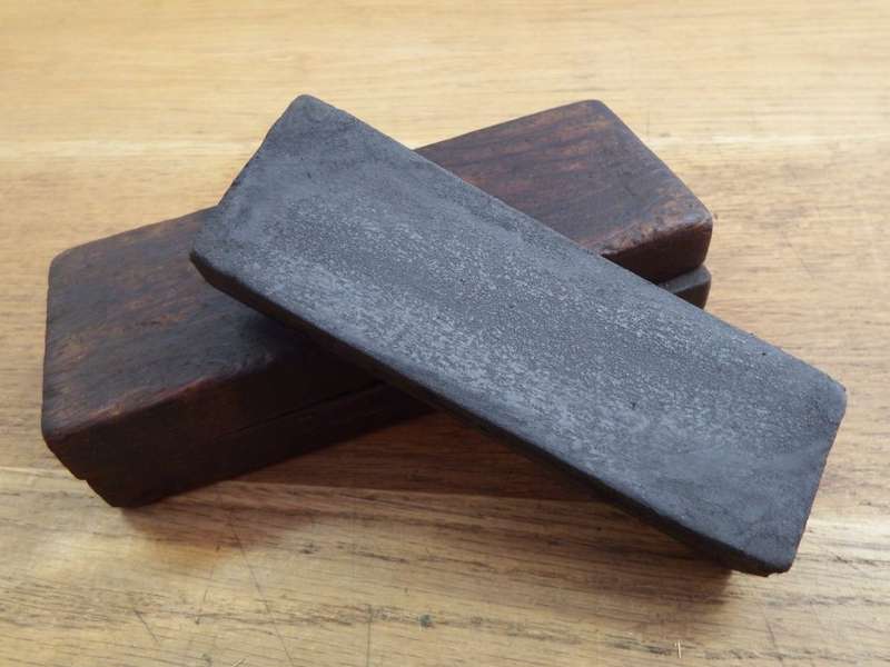 Vintage sharpening oil stone in wooden case