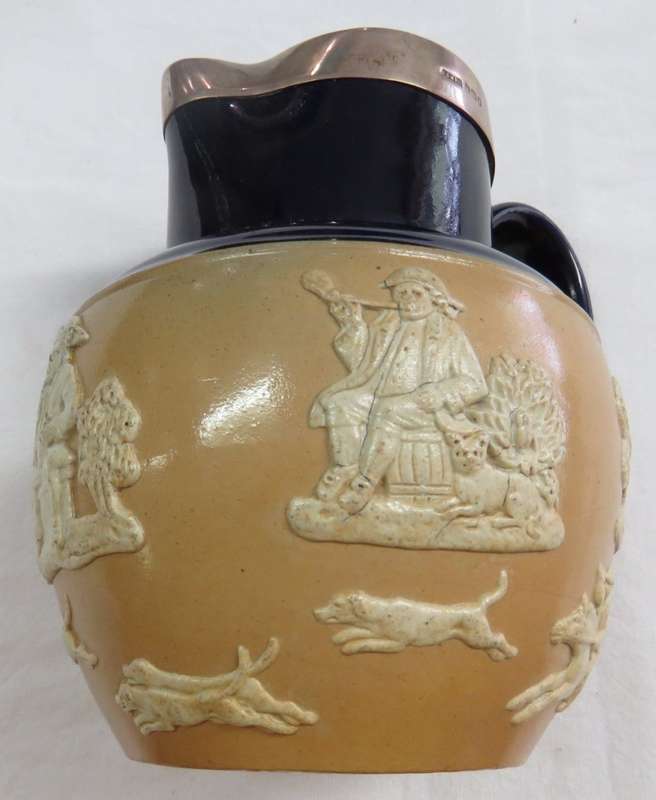 Antique Doulton Lambeth Stoneware jug with hallmarked silver rim - London 1902