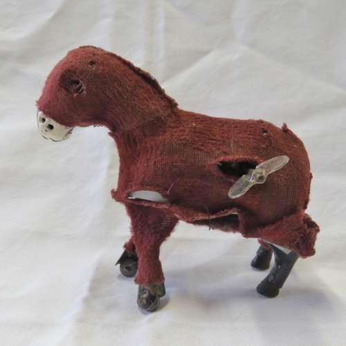 Vintage mechanical donkey with broken leg