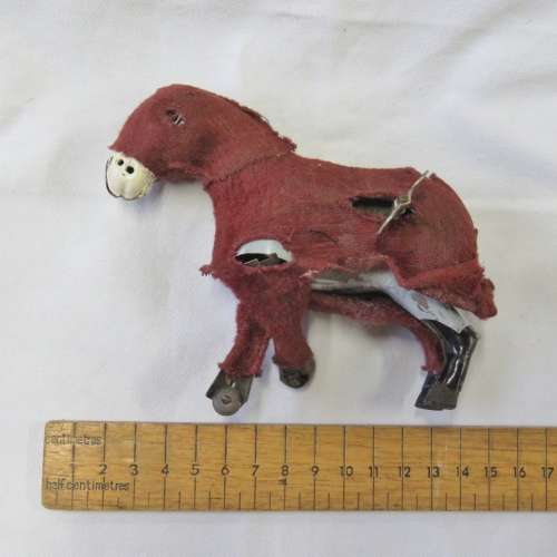 Vintage mechanical donkey with broken leg