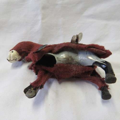 Vintage mechanical donkey with broken leg