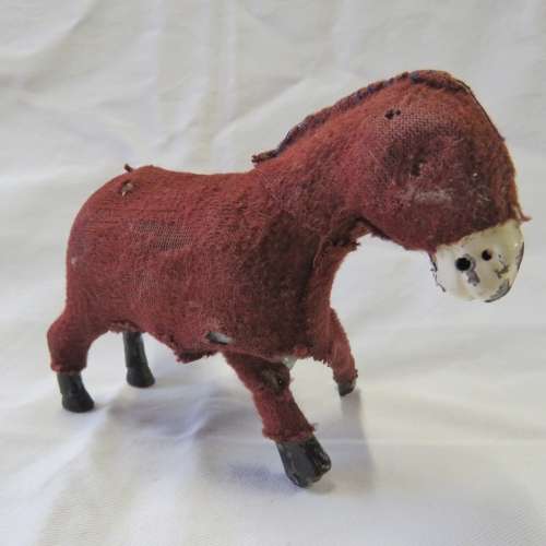 Vintage mechanical donkey with broken leg
