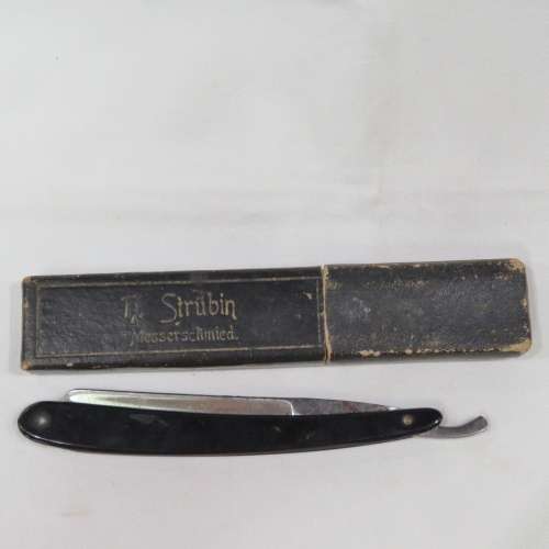 Vintage cut throat razor with chipped blade in box