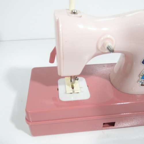 Vintage manual operated toy sewing machine