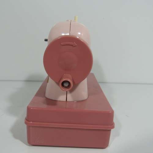 Vintage manual operated toy sewing machine