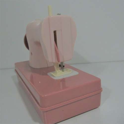 Vintage manual operated toy sewing machine