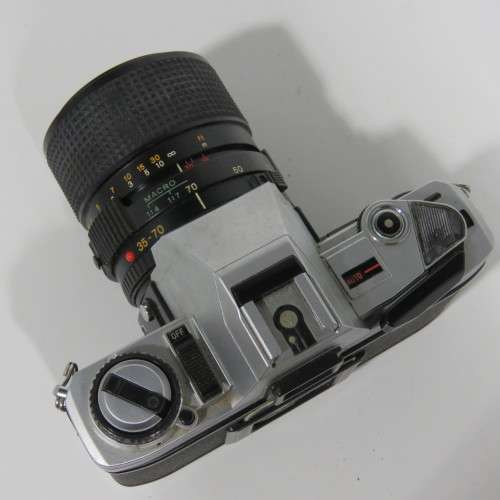 Vintage Minolta X-300 35mm camera with 1:3.5 Minolta 55mm lens