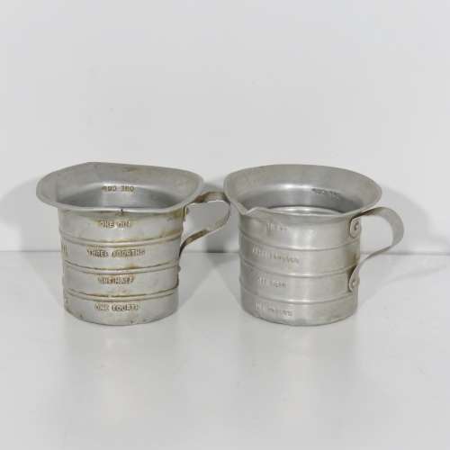 Pair of vintage Aluminium Royal measuring cups