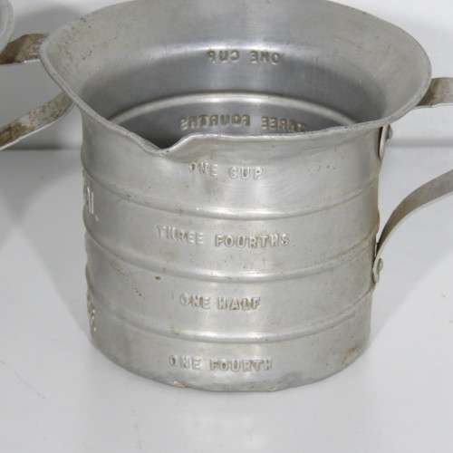 Pair of vintage Aluminium Royal measuring cups