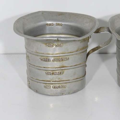 Pair of vintage Aluminium Royal measuring cups