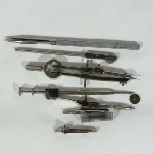 Vintage tin with technical drawing instrument parts
