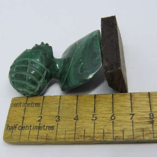 Malachite bust carving on wooden base