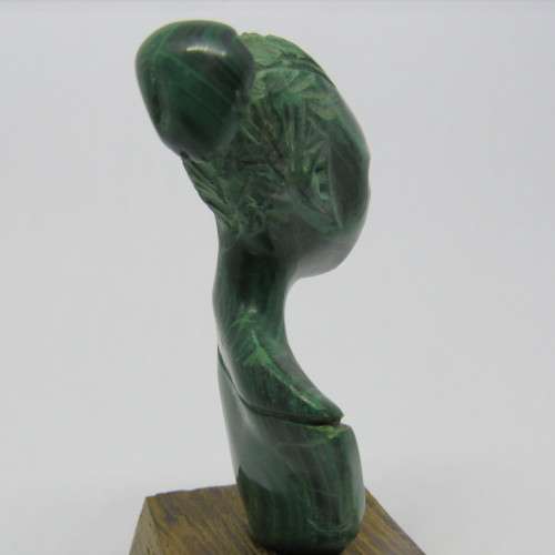 Malachite bust carving on wooden stand