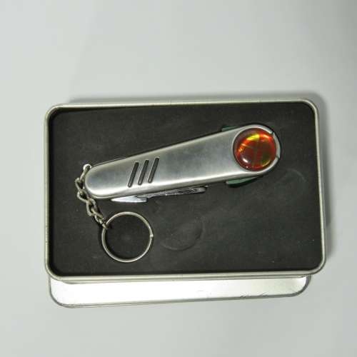 Golfer`s pocket knife tool in gift tin
