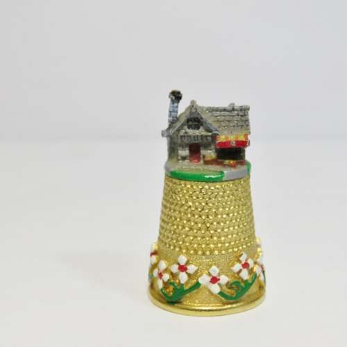 Vintage goldplated thimble village