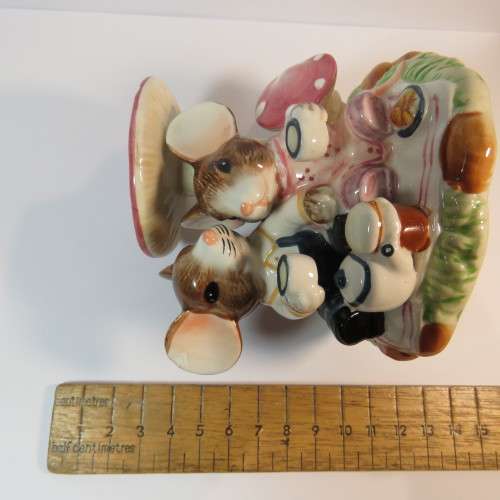 Porcelain mice having tea under mushroom figurine by Function Art