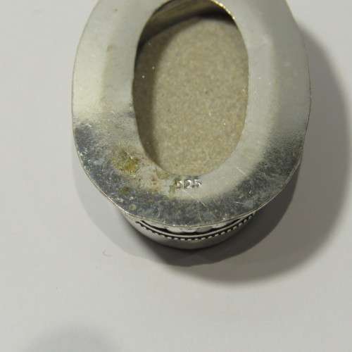 Sterling silver pendant with fossil inlay