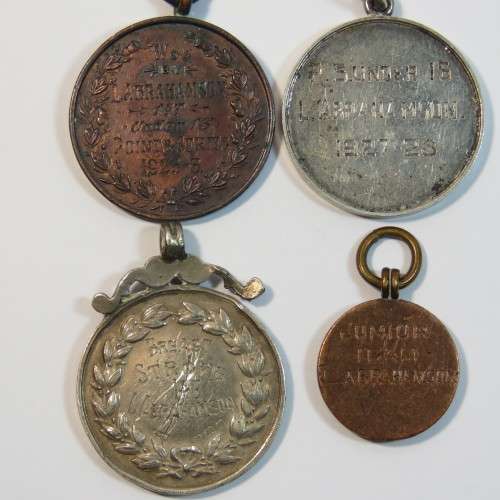 Lot of 4 swimming medals awarded to L.Abrahamson - Two in silver and 2 bronze