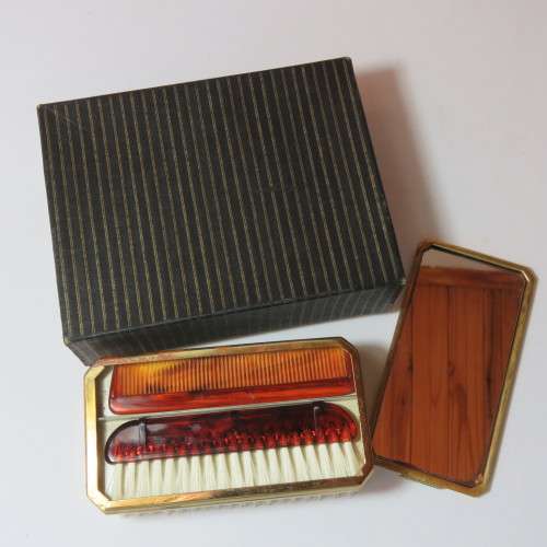 Vintage slide top brush with mirror and combs