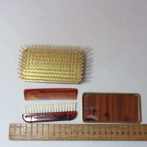 Vintage slide top brush with mirror and combs