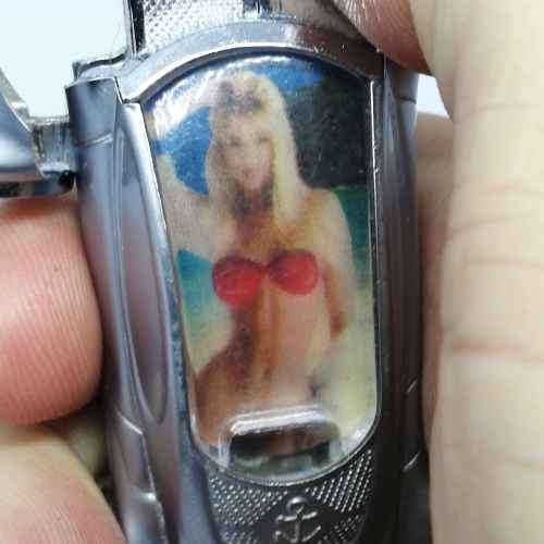 Car shaped pocket lighter with girl in bikini